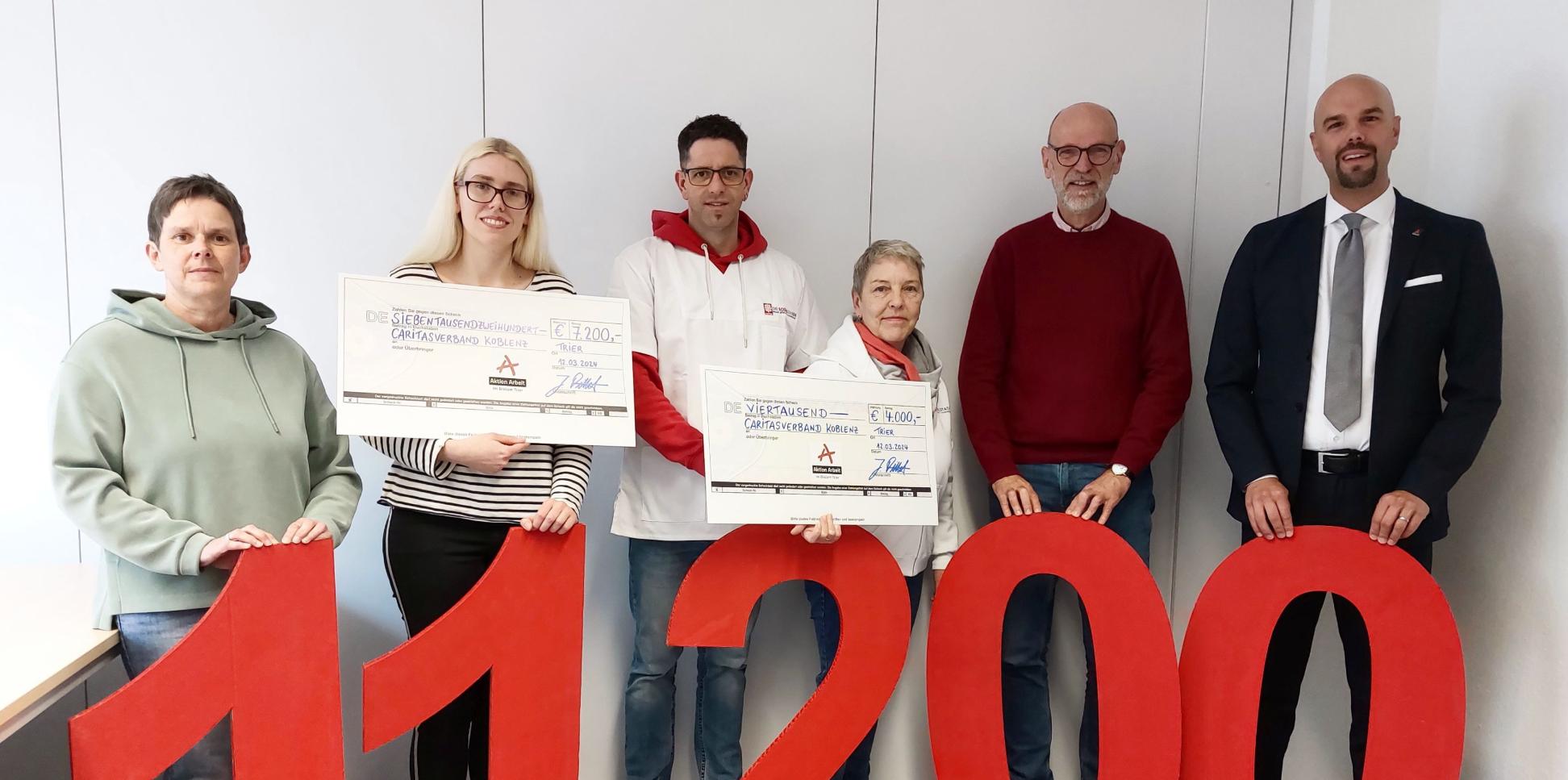 Symbolische Scheckübergabe beim Caritasverband Koblenz